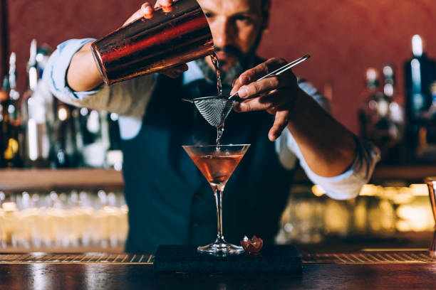 How do top bars use classic cocktails to train their bartenders?